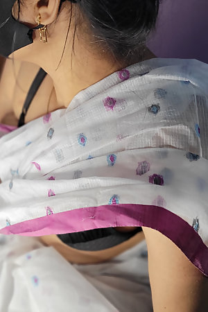 Beautiful Bangladeshi girl wearing a saree showing off her beautiful figure